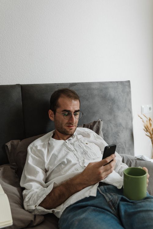 Reader catching up on email with morning coffee